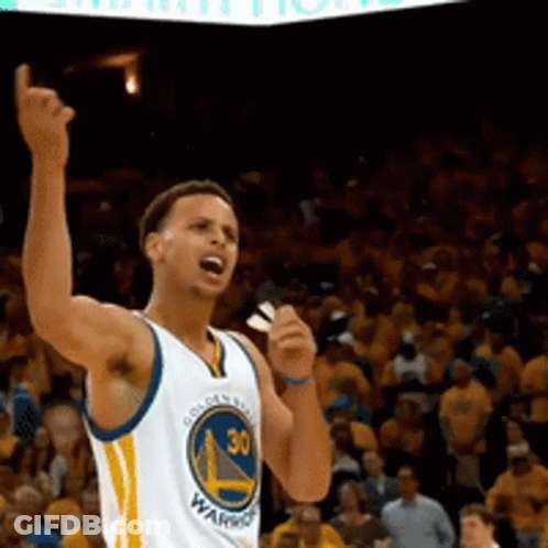 A Man Wearing A Golden State Warriors Jersey Stands On A Basketball Court GIF