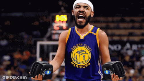A Man Wearing A Golden Toast Warriors Jersey Is Holding A Pair Of Boxing Gloves GIF
