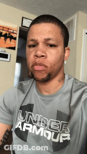 A Man Wearing A Gray Under Armour Shirt GIF
