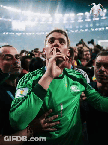 A Man Wearing A Green Adidas Jersey Holds His Finger To His Mouth GIF