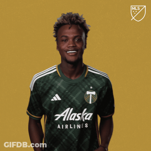A Man Wearing A Green Adidas Jersey Says " Vamos " GIF