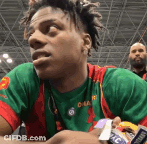 A Man Wearing A Green And Red Shirt That Says Omaha On It GIF