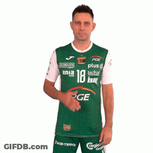 A Man Wearing A Green And White Pge Shirt Holds His Hand To His Chest GIF