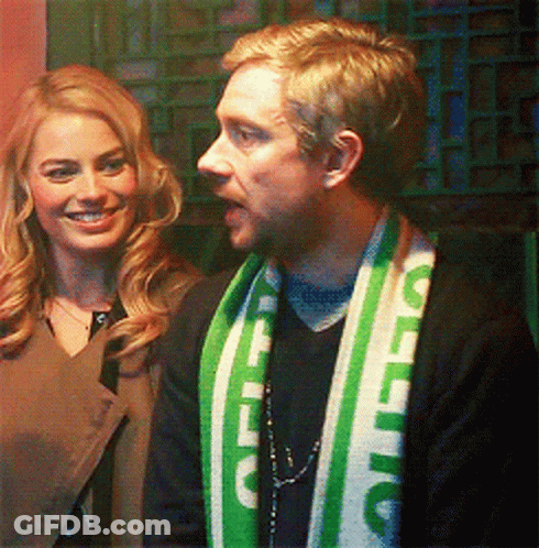 A Man Wearing A Green And White Scarf That Says Celtic On It GIF