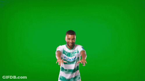 A Man Wearing A Green And White Shirt That Says Holland GIF