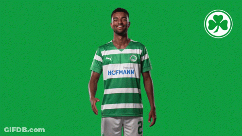 A Man Wearing A Green And White Striped Shirt With The Word Hoffmann On The Front GIF