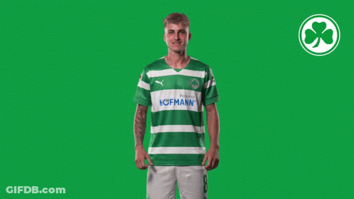 A Man Wearing A Green And White Striped Shirt With The Word Hofmann On It GIF
