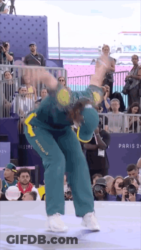 A Man Wearing A Green And Yellow Jersey With Australia On It GIF