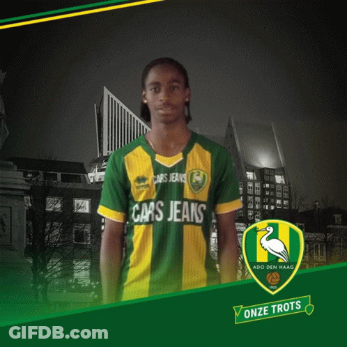 A Man Wearing A Green And Yellow Shirt That Says Cars Jeans On It GIF
