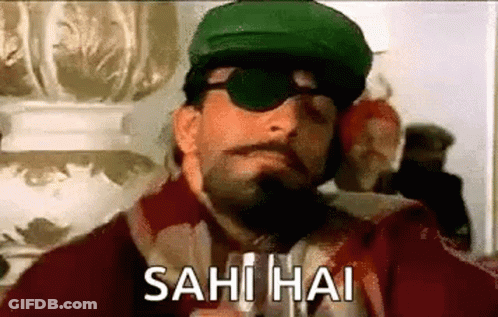 A Man Wearing A Green Hat And Sunglasses Is Smoking A Cigarette And Says Sahi Hai . GIF