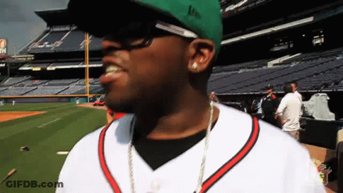 A Man Wearing A Green Hat That Says Lp On It GIF