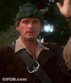 A Man Wearing A Green Hat With A S On It Holds His Head GIF
