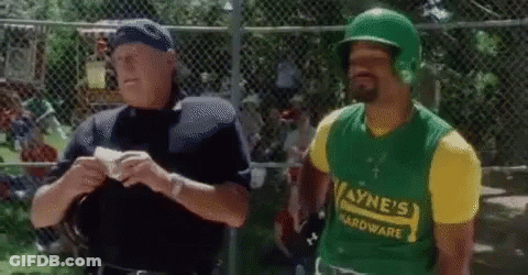 A Man Wearing A Green Helmet And A Yellow Shirt That Says Wayne 'S Hardware Is Talking To A Police Officer GIF