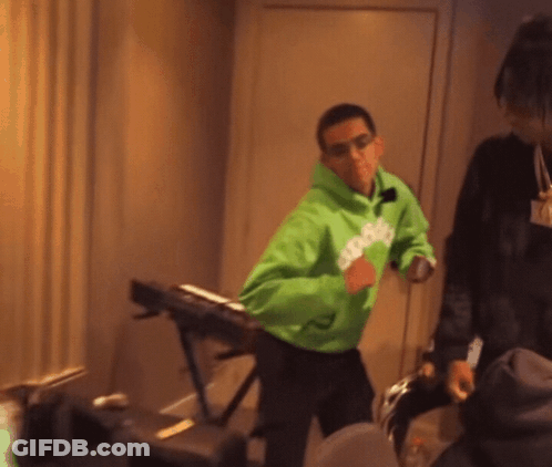 A Man Wearing A Green Hoodie That Says Snoop Dogg GIF