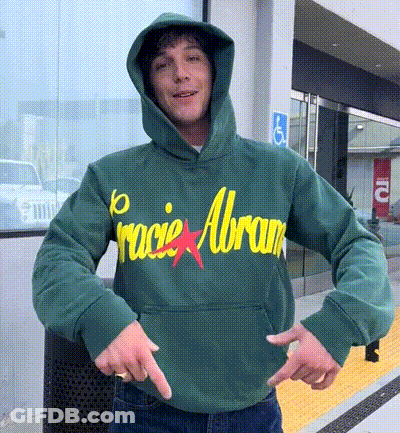A Man Wearing A Green Hoodie With The Word Racie Abram On It GIF