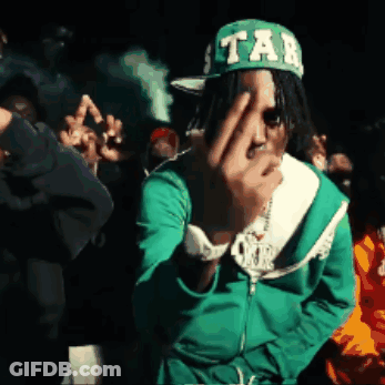 A Man Wearing A Green Jacket And A Green Hat With Tab On It GIF