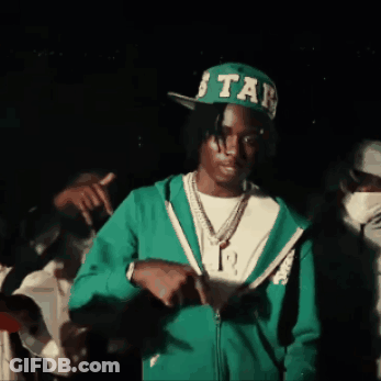 A Man Wearing A Green Jacket And A Green Hat With The Word Star On It GIF