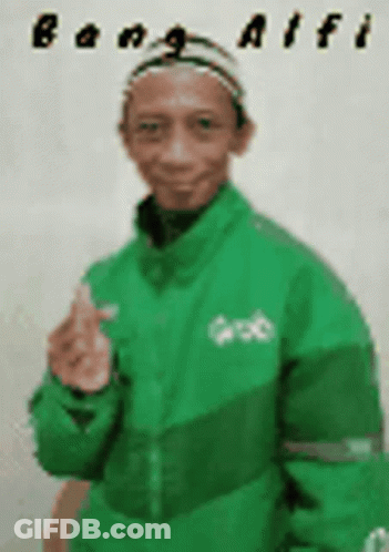A Man Wearing A Green Jacket And A Hat Is Giving A Thumbs Up . GIF
