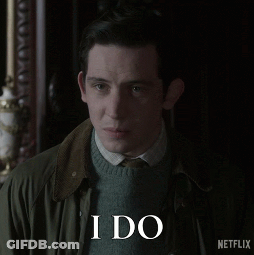 A Man Wearing A Green Jacket And A Sweater Says I Do GIF