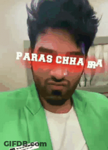 A Man Wearing A Green Jacket Has The Words Paras Chha Bra Written On His Face GIF