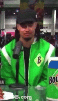 A Man Wearing A Green Jacket With The Letter B On The Front GIF