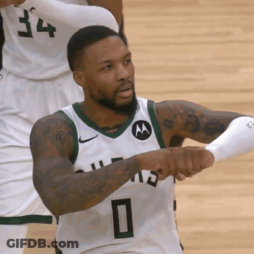 A Man Wearing A Green Jersey With The Number 0 On It GIF