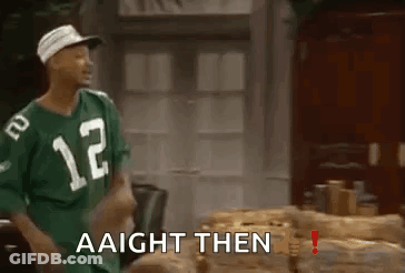 A Man Wearing A Green Jersey With The Number 12 On It Is Standing In Front Of A Table . GIF