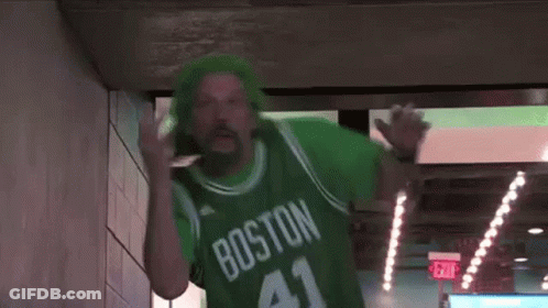 A Man Wearing A Green Jersey With The Number 41 On It Is Walking Through A Tunnel . GIF