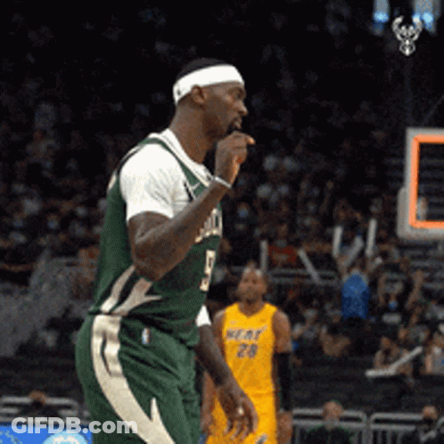 A Man Wearing A Green Jersey With The Number 5 On It GIF