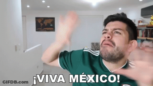 A Man Wearing A Green Jersey With The Words Viva Mexico On It GIF