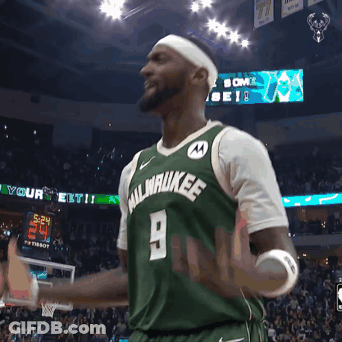 A Man Wearing A Green Milwaukee Jersey GIF