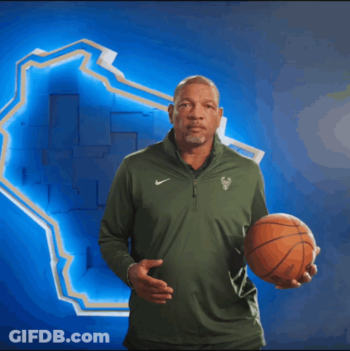 A Man Wearing A Green Nike Shirt Is Clapping GIF