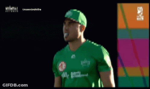 A Man Wearing A Green Shirt And A Green Hat With The Word Unseen Underneath GIF