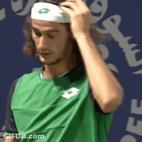 A Man Wearing A Green Shirt And A White Headband With A Lotto Logo On It GIF