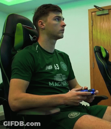 A Man Wearing A Green Shirt That Has The Number 63 On It GIF