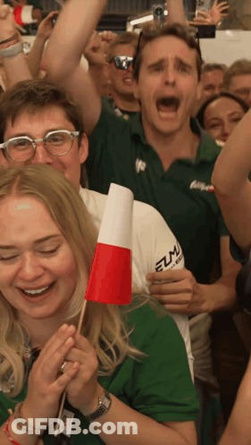 A Man Wearing A Green Shirt That Says Elma On It GIF