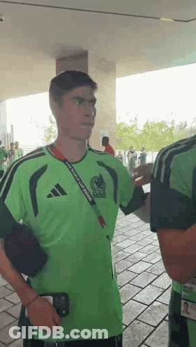 A Man Wearing A Green Shirt That Says Fifa World Cup Mexico GIF