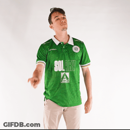 A Man Wearing A Green Shirt That Says Solary On It GIF