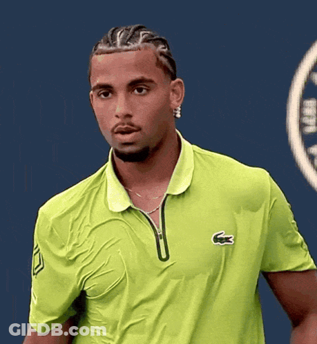 A Man Wearing A Green Shirt With A Lacoste Logo On The Front GIF