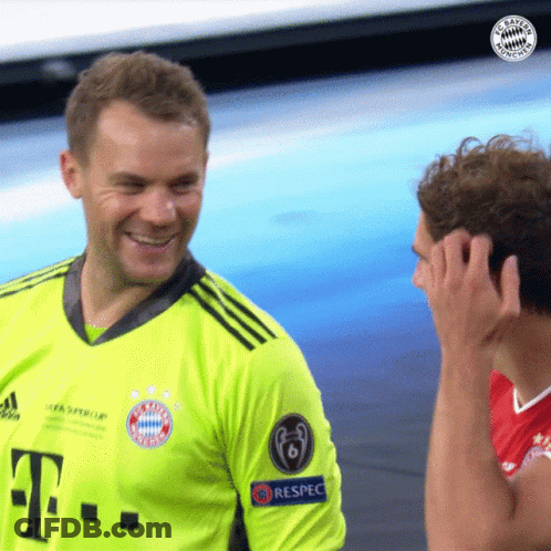 A Man Wearing A Green T-Mobile Jersey Is Smiling GIF