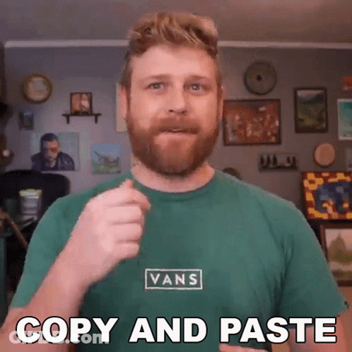 A Man Wearing A Green Vans Shirt Is Giving A Thumbs Up GIF