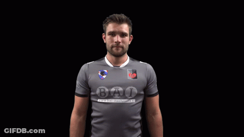 A Man Wearing A Grey Shirt That Says Bat GIF