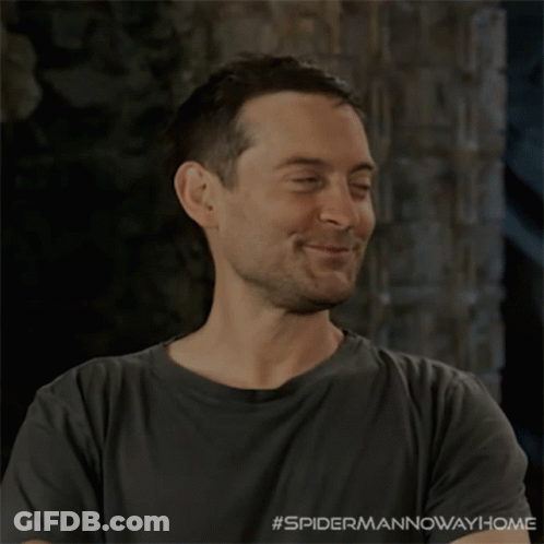 A Man Wearing A Grey Shirt With #Spidermannowaway Home Written On The Bottom GIF