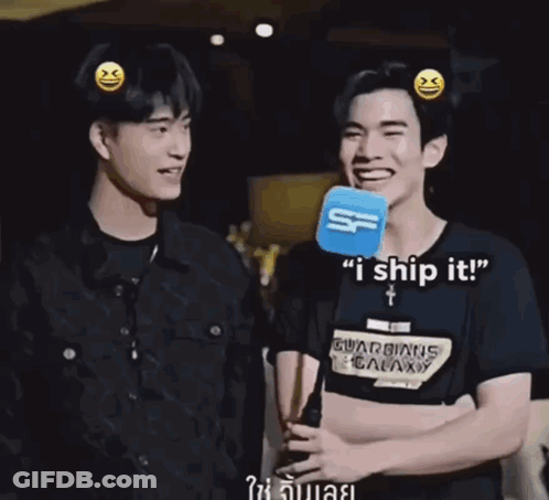 A Man Wearing A Guardians Of The Galaxy Shirt Talks Into A Microphone While Another Man Laughs GIF