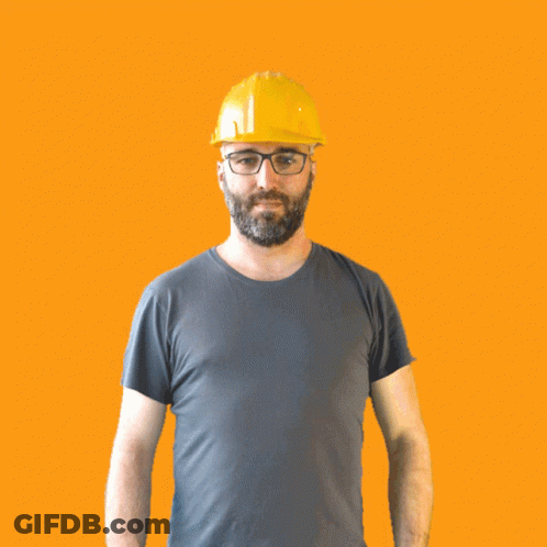 A Man Wearing A Hard Hat And Glasses Is Making A Thumbs Down Sign GIF