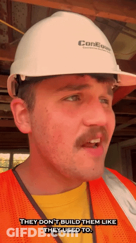 A Man Wearing A Hard Hat And Orange Vest Says They Don 'T Build Them Like They Used To GIF