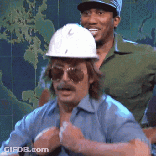A Man Wearing A Hard Hat And Sunglasses Stands Next To Another Man GIF