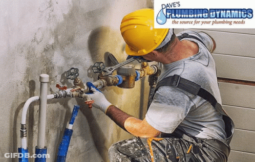 A Man Wearing A Hard Hat Is Working On A Pipe With Dave 'S Plumbing Dynamics Written On The Bottom GIF
