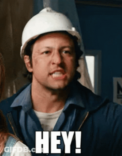 A Man Wearing A Hard Hat Says " Hey " GIF