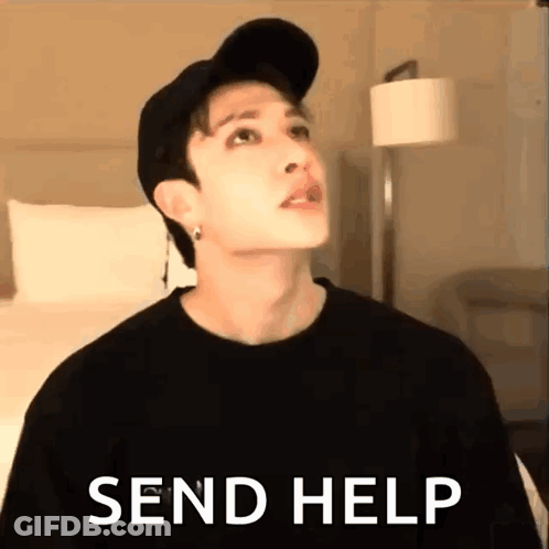 A Man Wearing A Hat And A Black Shirt Is Standing In A Room With The Words `` Send Help '' . GIF